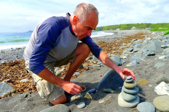 Stone Crazy: Paul stacking stones on Crescent Beach