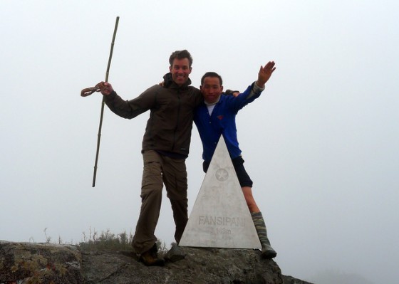 Celebratory photo atop Mt. Fansipan with my hardy H'Mong guide Mi-to-sa