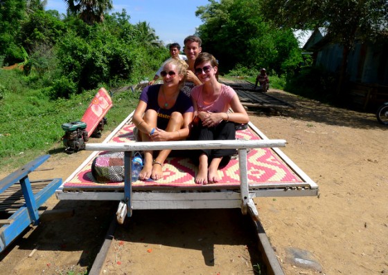 With travel buddies Claire and Evelin on the bamboo train in Battambang