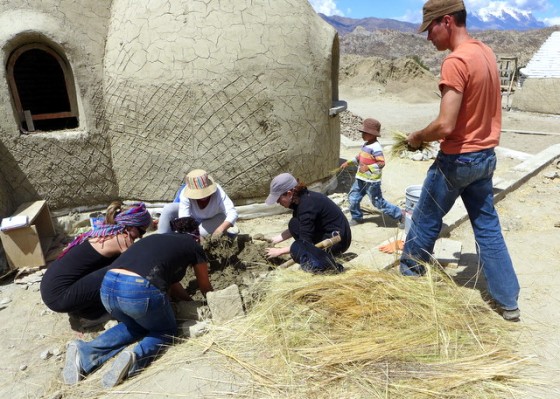 Getting ready to mix the straw in the mud to make adobe for the walls