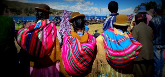 Chola women watching a bullfight in the altiplano