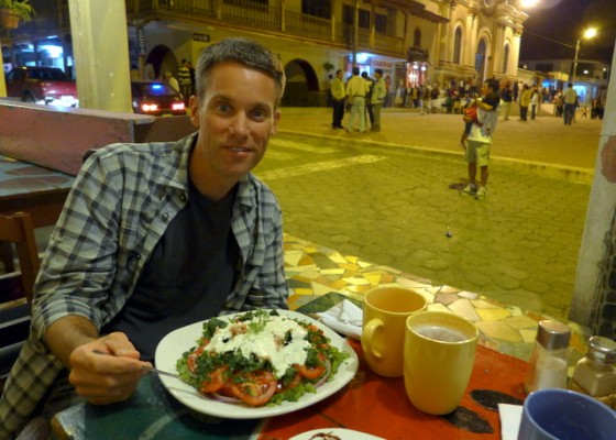 Enjoying a salad, note the beer is clandestinely served in coffee mugs on Sundays when the sale of alcohol is prohibited in Ecuador