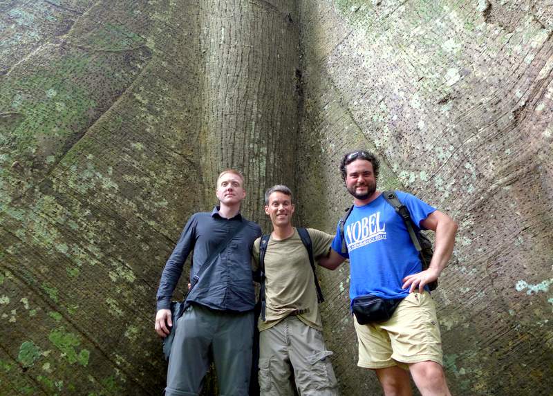 With trek-mates Richard and Leonardo at trail’s end in Tapajós National Forest in front of a 900-year old samaúma tree.