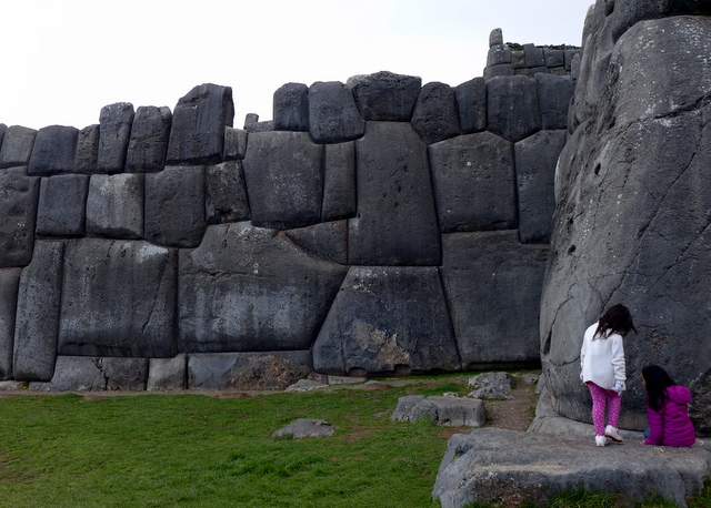 Children playing alongside the massive stone ramparts