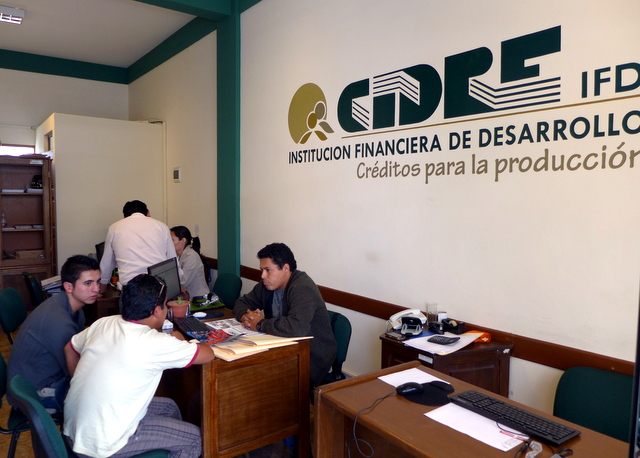 My CIDRE office in the Chimba neighborhood office in Cochabamba.  My co-workers busily getting new clients signed up for a Kiva-funded low interest loan.