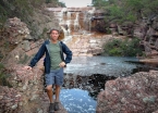 At a decent waterfall on the road to the Cachoeira da Fumaça trailhead.