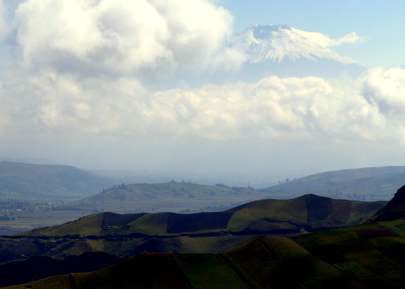 A surprise view of snow-encased Volcán Cotopaxi, soaring to a height of 5,897 m (19,347 ft)