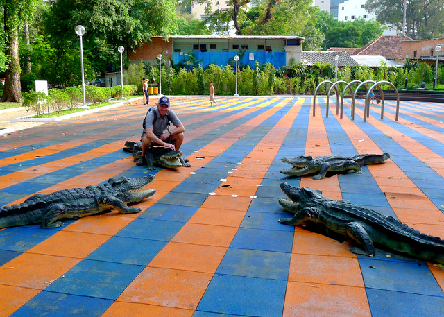 Riding the crocodiles in a children\'s park in Saigon