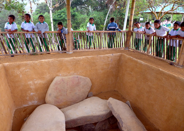 The burial sites can be several meters deep, here a local schoolchildren visit San Agustín