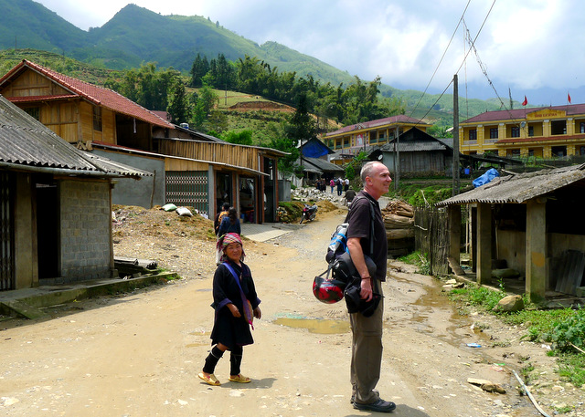 Paul with a H\'Mong \"guide\" in the village of Hoa Su Pan, she was about half his size.