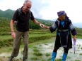 Paul is helped out of the rice paddy he fell into by an aged H\'Mong villager, she proceeded to hold is hand as an escort the rest of the way out of the terraces