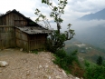 Wooden H\'Mong homes perched perilously on the side of the mountain.  Great valley views, though.