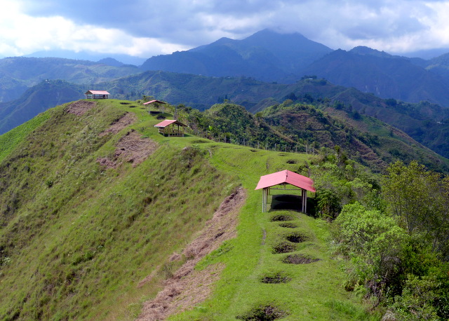 Tierradentro\'s Alto del Aguacate burial sites perched dramatically on a thin ridge high above San Andrés