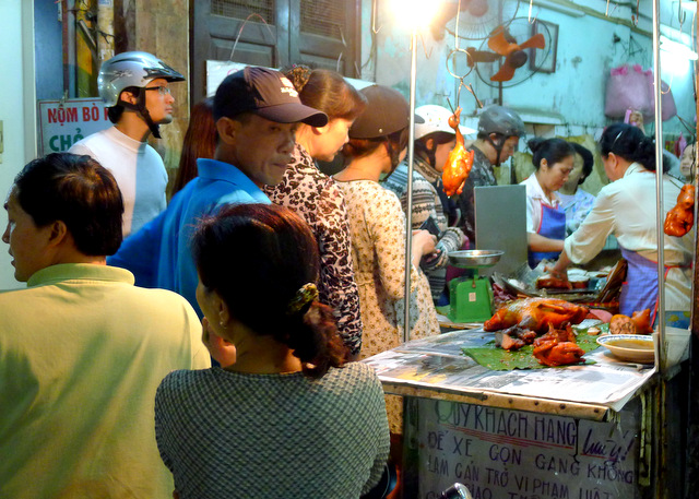Popular street food eatery in Hanoi\'s Old Quarter, locals queue for the good stuff