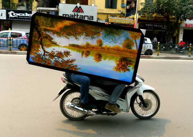 Local transport: no cargo is off-limits for the omnipresent scooters in the streets of Hanoi